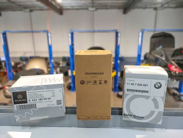 OEM vs aftermarket car parts comparison showing automotive spare parts